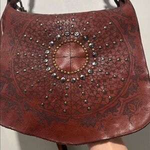 CAMPOMAGGI saddle engraved bag